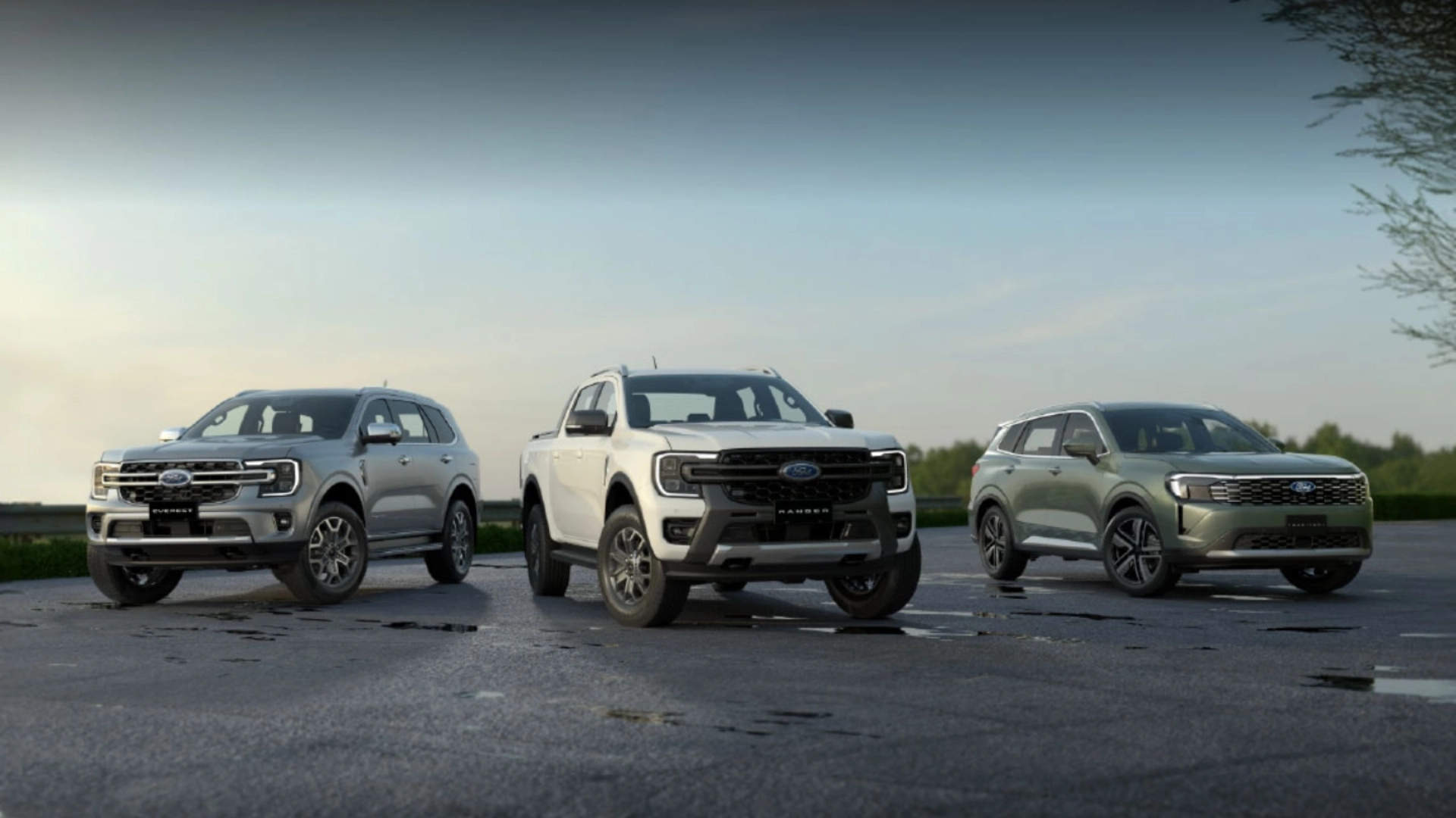 three cars grey,white and green facing in front